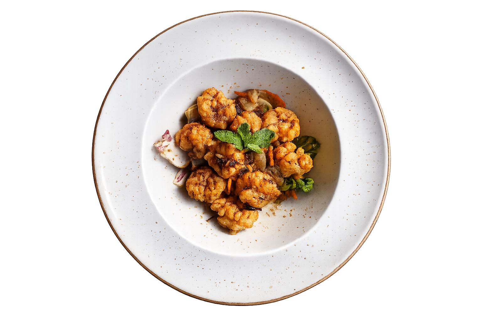 Golden-fried cauliflower bites garnished with a mint leaf on a white speckled plate.